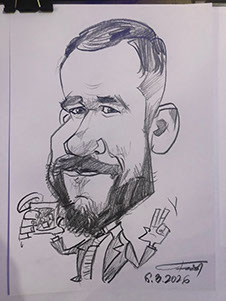 Karikaturista Janko kreslí vtipný narodeninový portrét jubilanta na oslave 50. narodenín. 