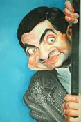 Farebná karikatúra Mr. Beana s jeho typickým zmäteným výrazom, veľkými očami a odstávajúcimi ušami