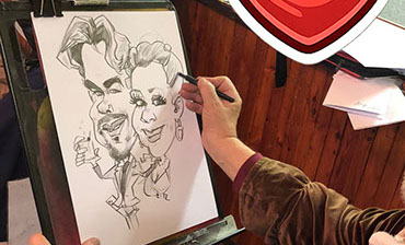 Karikaturista Janko kreslí na svadbe dvojportrét&nbsp; na a3.